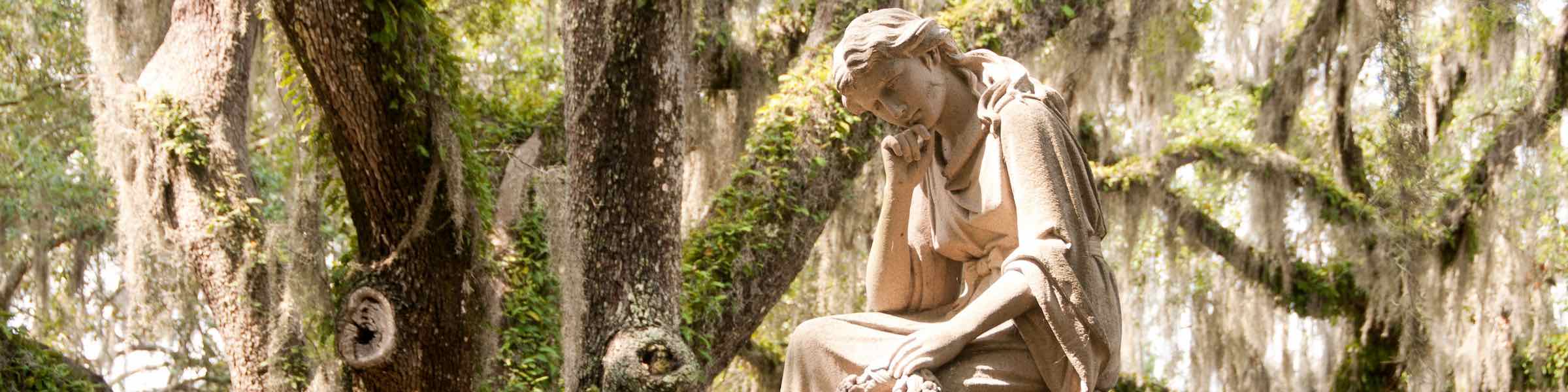 Statue of a female figure in a Savannah, GA cemetery.