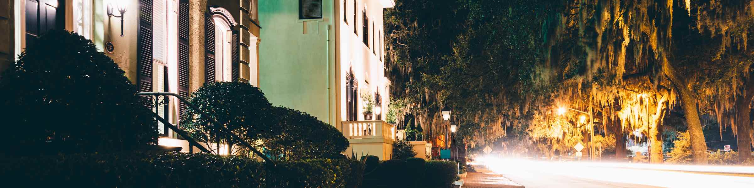 Night time view of Drayton Street and Forsyth Park, Savannah, GA.