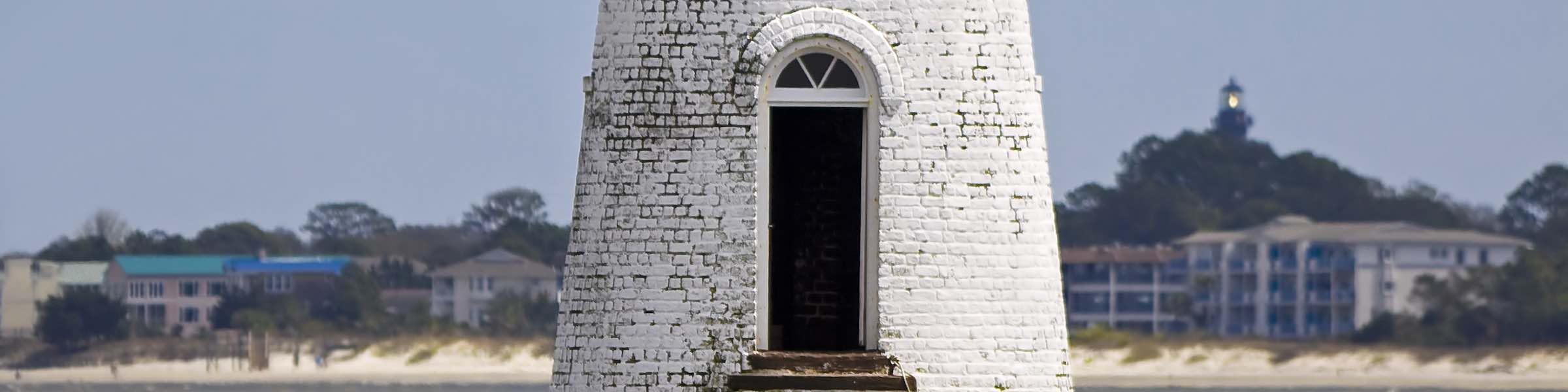 Cockspur Island Lighthouse, with the Tybee Island Lighthouse visible in the background